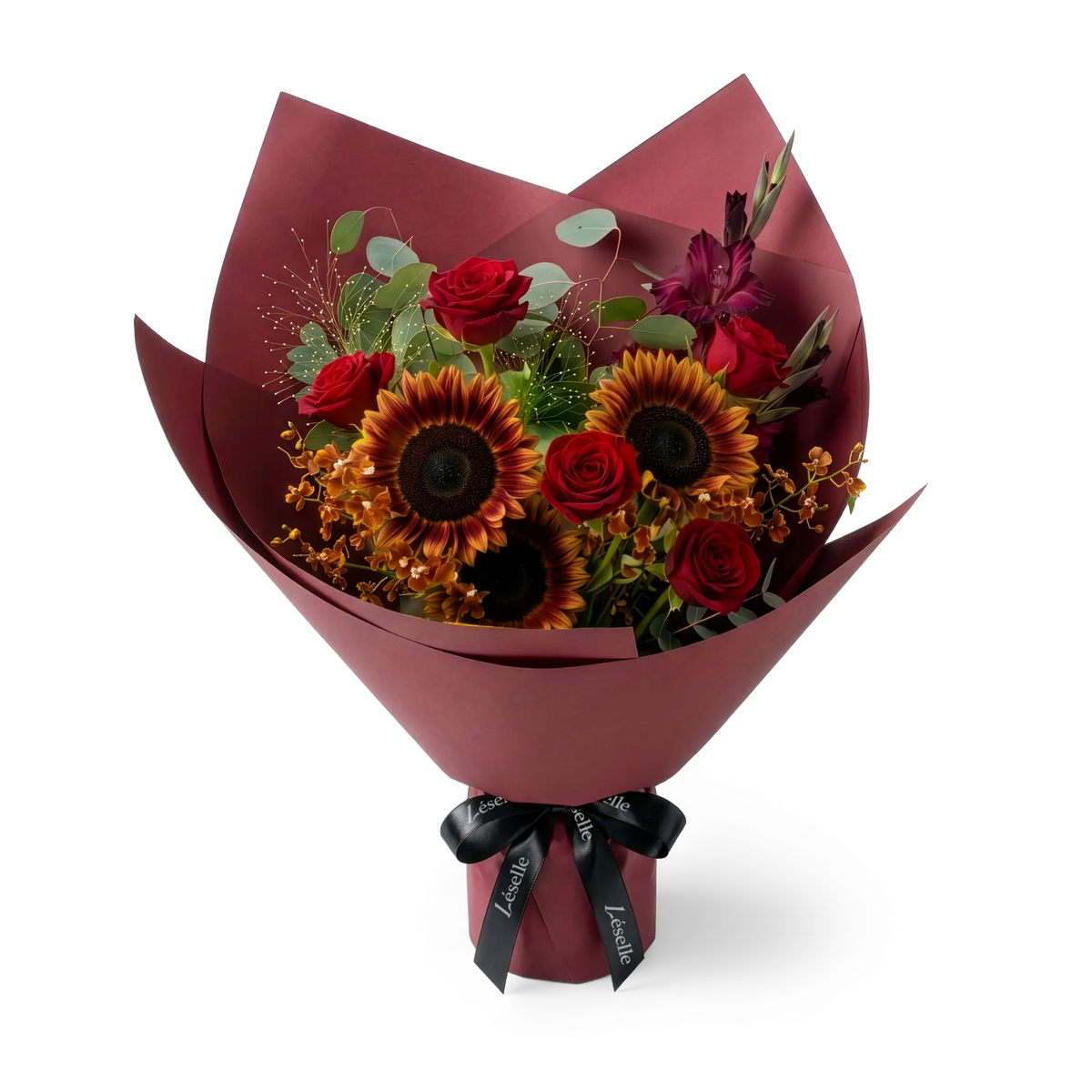 A fresh flower bouquet wrapped in burgundy paper with a black ribbon, featuring burgundy sunflowers, red roses, and small flowers, set against a transparent background.